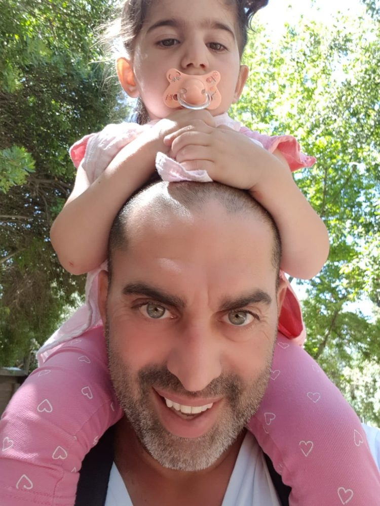 Yeron with Emmanuel on his shoulders